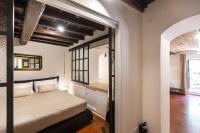 A bed or beds in a room at Pantheon by Agrippa Suite