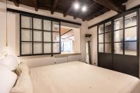 A bed or beds in a room at Pantheon by Agrippa Suite