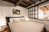 A bed or beds in a room at Pantheon by Agrippa Suite
