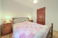 Posteľ alebo postele v izbe v ubytovaní Apartmani Belvedere