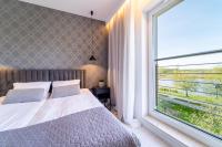 Łóżko lub łóżka w pokoju w obiekcie Bella Vista - 3pok, 5 łóżek, centrum, parking, winda, widok na rzekę, Netflix