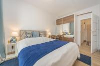 Łóżko lub łóżka w pokoju w obiekcie Abrahama Comfort Apartments