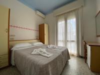 Posteľ alebo postele v izbe v ubytovaní Hotel Nanni Garnì