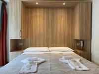 Posteľ alebo postele v izbe v ubytovaní Hotel Nanni Garnì