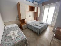 Posteľ alebo postele v izbe v ubytovaní Hotel Nanni Garnì