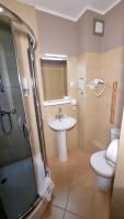 Kúpeľňa v ubytovaní Carina Hotel