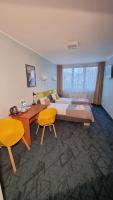 Posteľ alebo postele v izbe v ubytovaní Carina Hotel