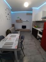 A kitchen or kitchenette at CASA ALEXSA Intero appartamento o CAMERA ALEXSA Camera matrimoniale con patio