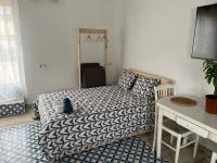 A bed or beds in a room at Alzira bonita Ático E Plaza Mayor con gran terraza