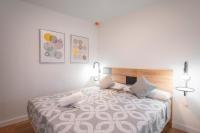 A bed or beds in a room at Plaza Nueva HOMES