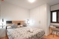 A bed or beds in a room at Plaza Nueva HOMES