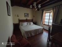 Postel nebo postele na pokoji v ubytování Hotel Rural Ovio