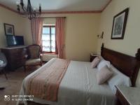 Postel nebo postele na pokoji v ubytování Hotel Rural Ovio
