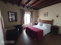 Postel nebo postele na pokoji v ubytování Hotel Rural Ovio