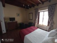 Postel nebo postele na pokoji v ubytování Hotel Rural Ovio