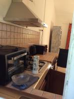 a kitchen with a counter top with a microwave at LA KAZ A DADA in Sainte-Suzanne