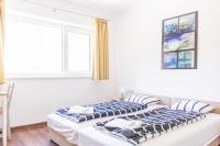 Posteľ alebo postele v izbe v ubytovaní Wesselényi Strand apartmanok