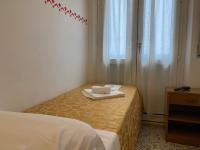 Posteľ alebo postele v izbe v ubytovaní Hotel Nanni Garnì