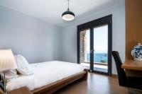 A bed or beds in a room at Red Rock villa, Plaka Elounda