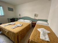 Posteľ alebo postele v izbe v ubytovaní Hotel Nanni Garnì