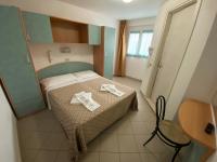Posteľ alebo postele v izbe v ubytovaní Hotel Nanni Garnì
