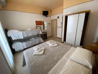Posteľ alebo postele v izbe v ubytovaní Hotel Nanni Garnì
