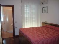 A bed or beds in a room at Albergo Centopini
