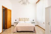A bed or beds in a room at Paco House