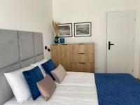 Posteľ alebo postele v izbe v ubytovaní P&A APARTAMENT