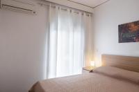 Posteľ alebo postele v izbe v ubytovaní Kamelia Apartment
