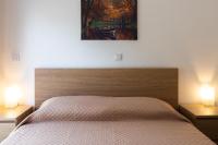Posteľ alebo postele v izbe v ubytovaní Kamelia Apartment