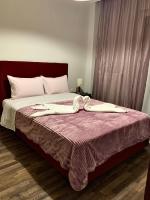 Postel nebo postele na pokoji v ubytování A&D City Apartment