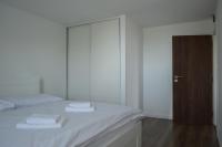 A bed or beds in a room at Ager Apartments