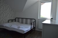 A bed or beds in a room at Ager Apartments