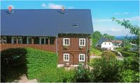 a house with a black roof and white windows at Pension U Lipy in Děčín