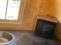 Televízia a/alebo spoločenská miestnosť v ubytovaní La cabane du Panda