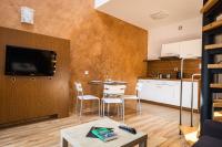 Televízia a/alebo spoločenská miestnosť v ubytovaní Natura Resort