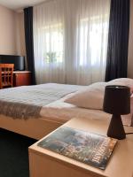 Postel nebo postele na pokoji v ubytování Hotel Marislav