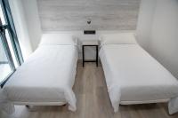 Posteľ alebo postele v izbe v ubytovaní Hotel Chips Fene