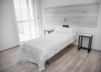 Posteľ alebo postele v izbe v ubytovaní Hotel Chips Fene
