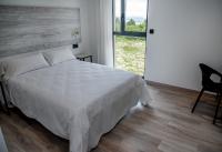 Posteľ alebo postele v izbe v ubytovaní Hotel Chips Fene