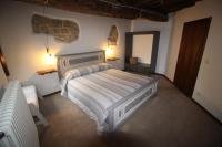 A bed or beds in a room at casa vacanze Castiglione - 4 posti letto