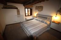 A bed or beds in a room at casa vacanze Castiglione - 4 posti letto