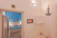 Łóżko lub łóżka w pokoju w obiekcie Approdo Rooms - Eja Sardinia