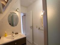 a bathroom with a sink and a mirror at Gîte Domme, 5 pièces, 8 personnes - FR-1-616-23 in Domme