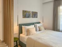 Łóżko lub łóżka w pokoju w obiekcie Portobello Boutique Hotel