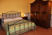 A bed or beds in a room at B&B Mela
