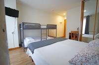 Postel nebo postele na pokoji v ubytování Villa de Colunga