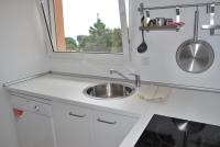 a kitchen with a sink and a mirror at Residence Conca Blue in Conca