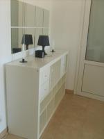 a room with a desk with a lamp and a mirror at Residence Conca Blue in Conca
